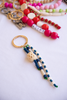 Colorful beaded keychains on a white surface