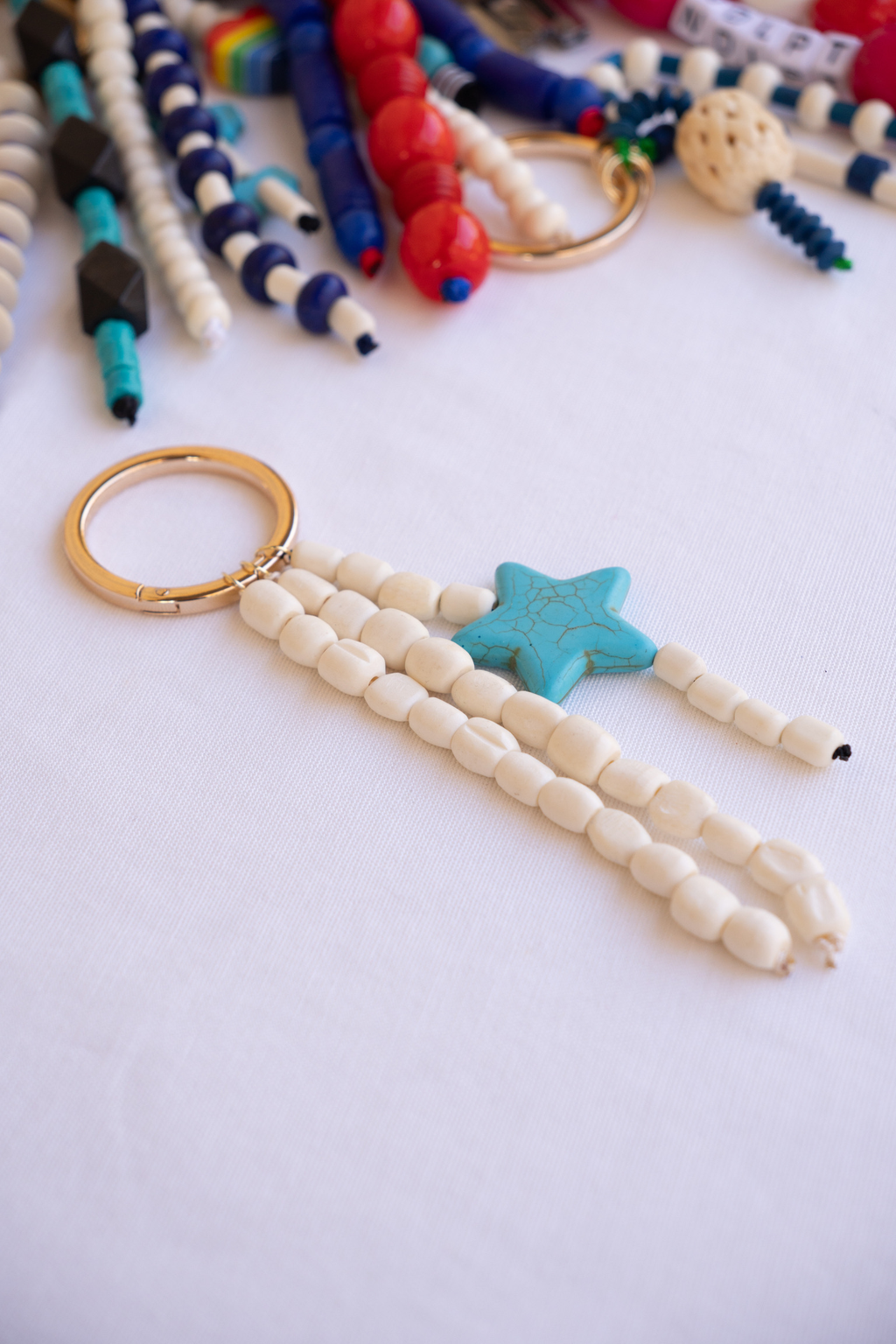 Beaded keychain with star charm on a white background