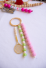 Beaded keychain with tennis racket charm on a white background