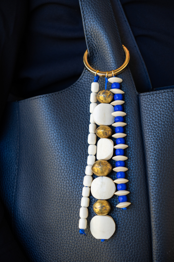 Decorative keychain with beads on a car seat
