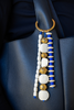 Decorative keychain with beads on a car seat