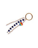 Keychain with beads and a rainbow charm on a white background
