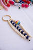 Beaded keychain with rainbow heart charm on a white background