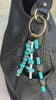 Video of beaded bag charm with black and turquoise stones